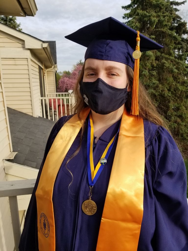 Elizabeth in her cap and gown - ready for graduation from Schoolcraft College